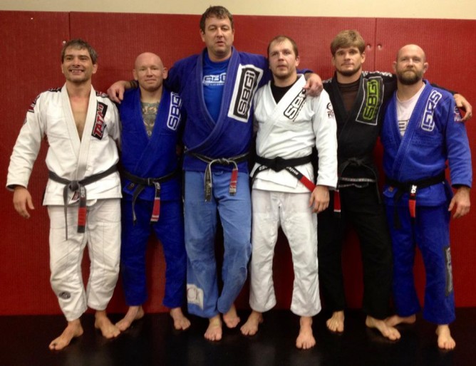 Matt with some of his black belts