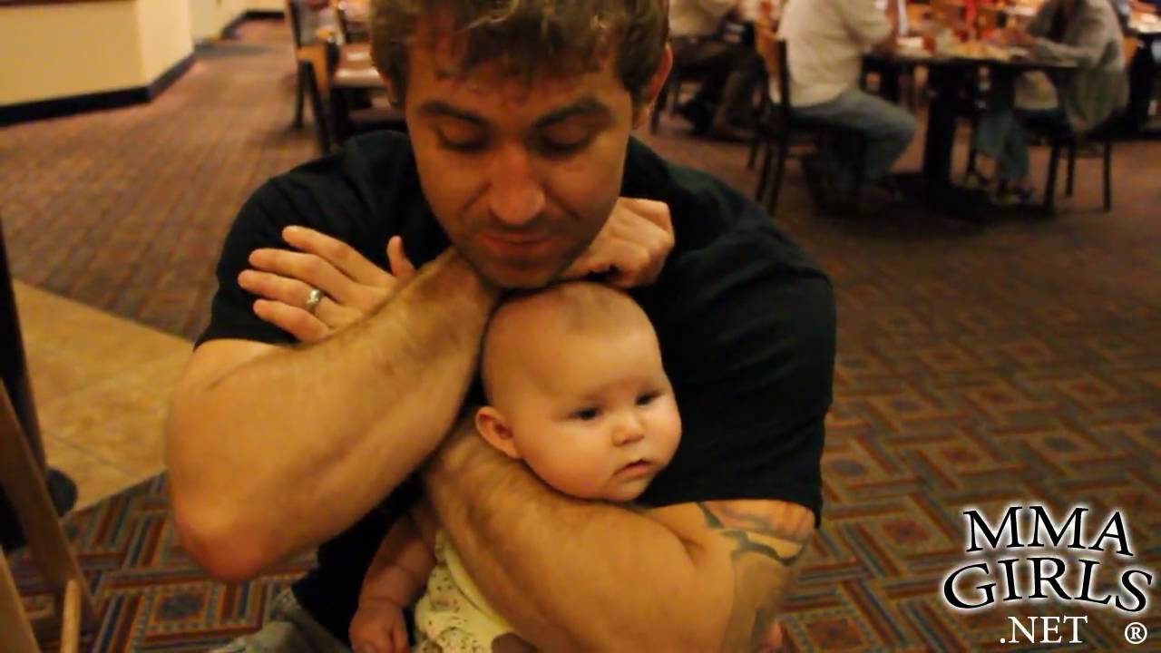 Alan Belcher Demonstrates Rear Naked Choke on Baby with Squishy Cheeks