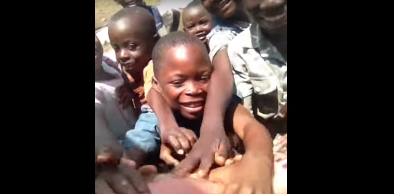Watch: MMA Fighter Travels to Congo; 1st Time Kids See a White Guy
