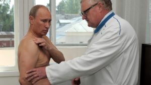 Russian Prime Minister Vladimir Putin (L) received consultation from traumatologist Viktor Petrachenkov during his visit to Smolensk Regional Hospital on August 25, 2011. Putin said he has hurt his shoulder during morning Judo practice. AFP PHOTO/ RIA-NOVOSTI/ ALEKSEY DRUZHININ (Photo credit should read ALEKSEY DRUZHININ/AFP/Getty Images)