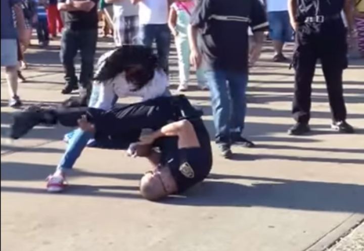 White Belt Cop Attempts To Armbar Woman; She Counters with a Reversal