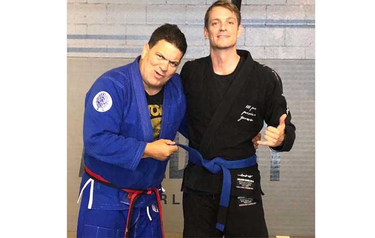 Actor Kinnaman promoted to blue belt and Rigan Machado wears a strange looking belt