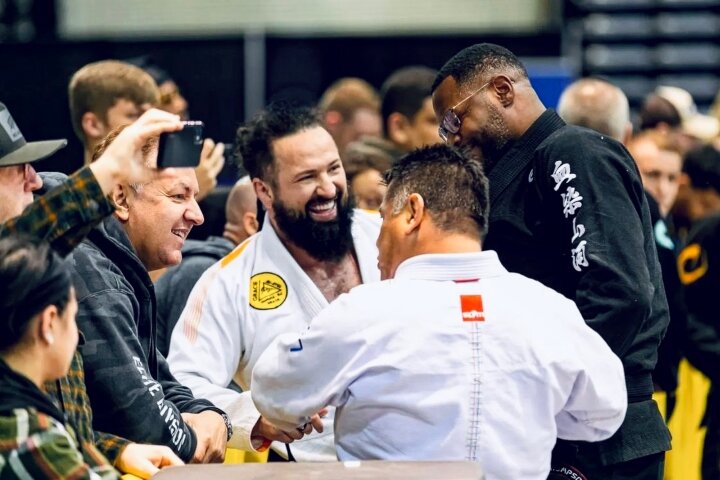 Zoltan Bathory smiling at a BJJ competition with other competitors