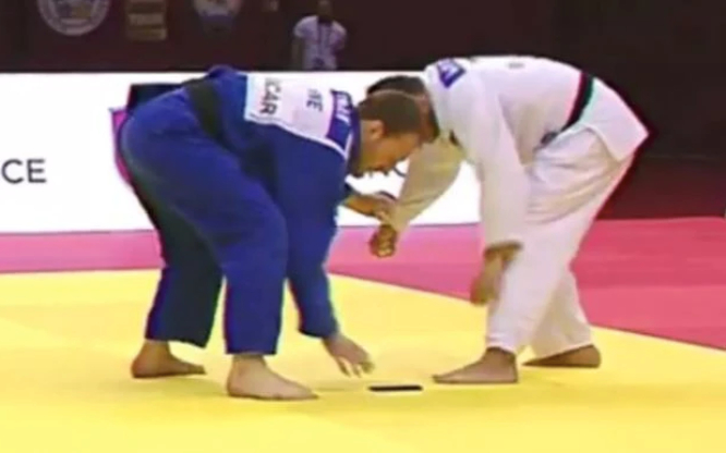 Judoka Drops Cell Phone During Championship Match & Is Eliminated